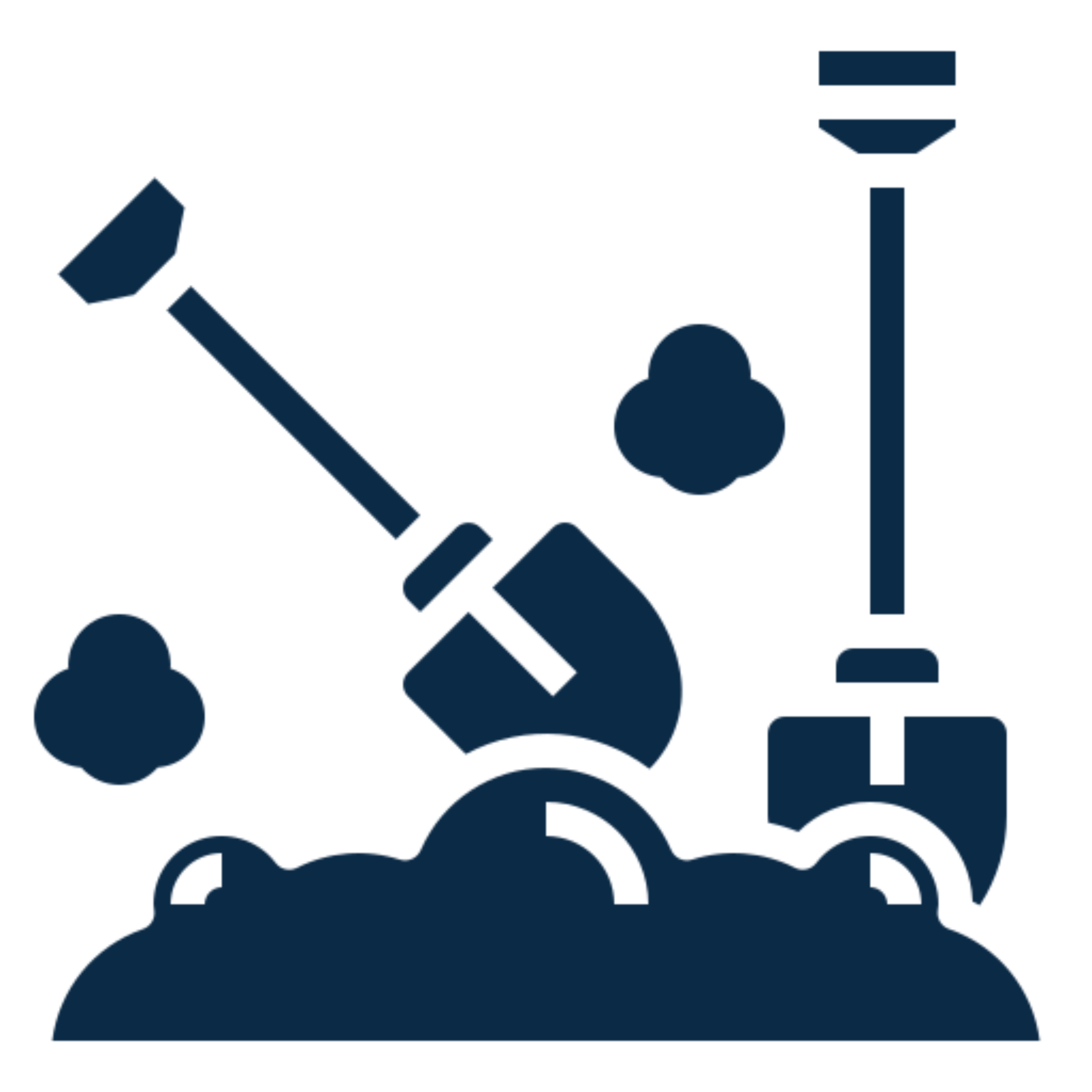 Shovel and axe in dirt silhouette.